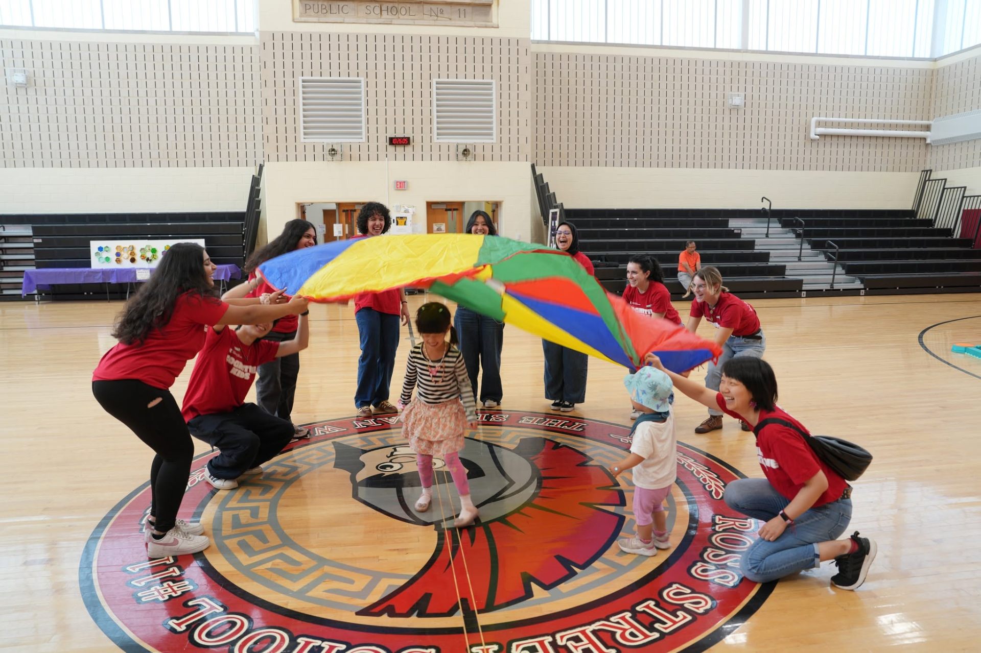 Parachute play with volunteers