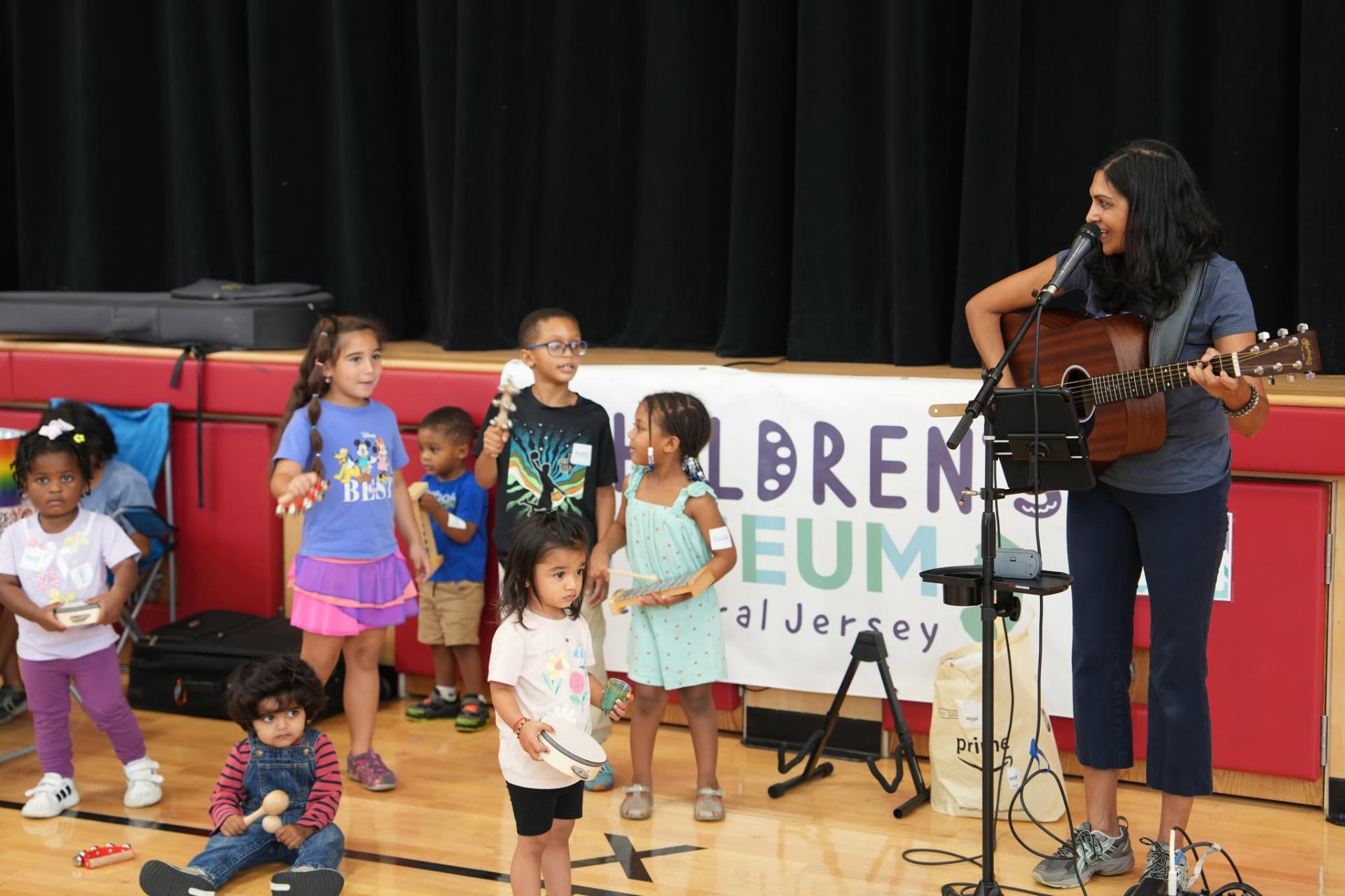 Kids playing instruments during a sing-along